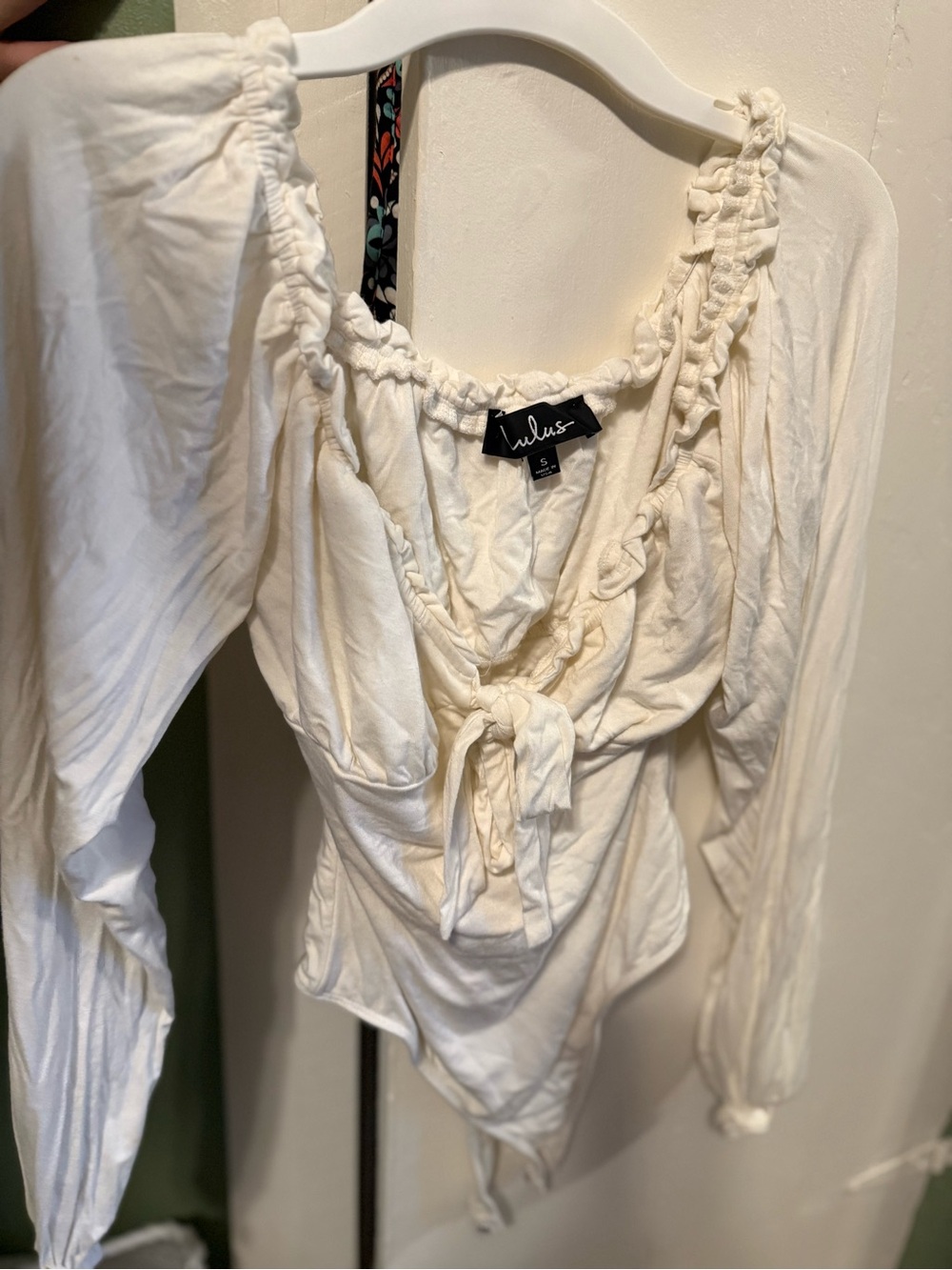Lulu's Cream Tie-Front Ruffled Scoop Long Sleeve Bodysuit